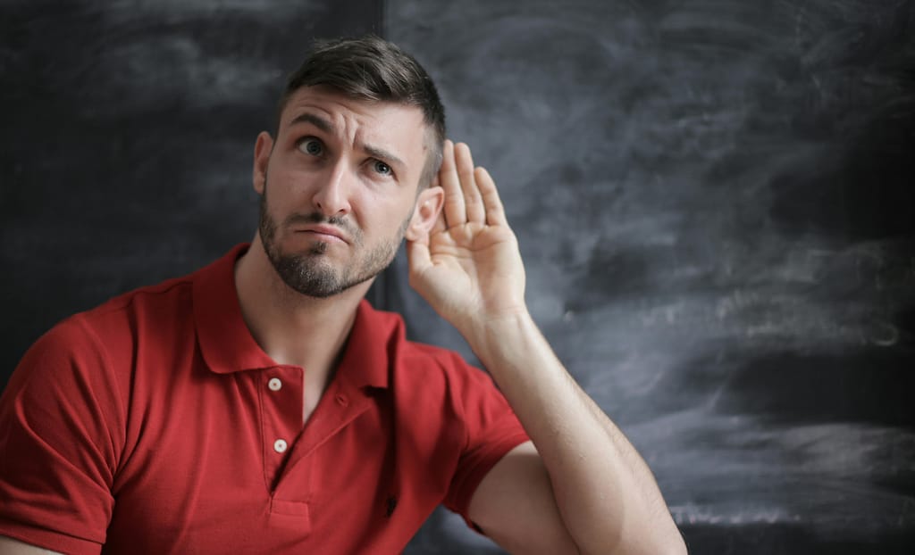 Bearded man with a well-groomed, full beard looking confident, highlighting the importance of proper beard care and debunking common beard care myths.